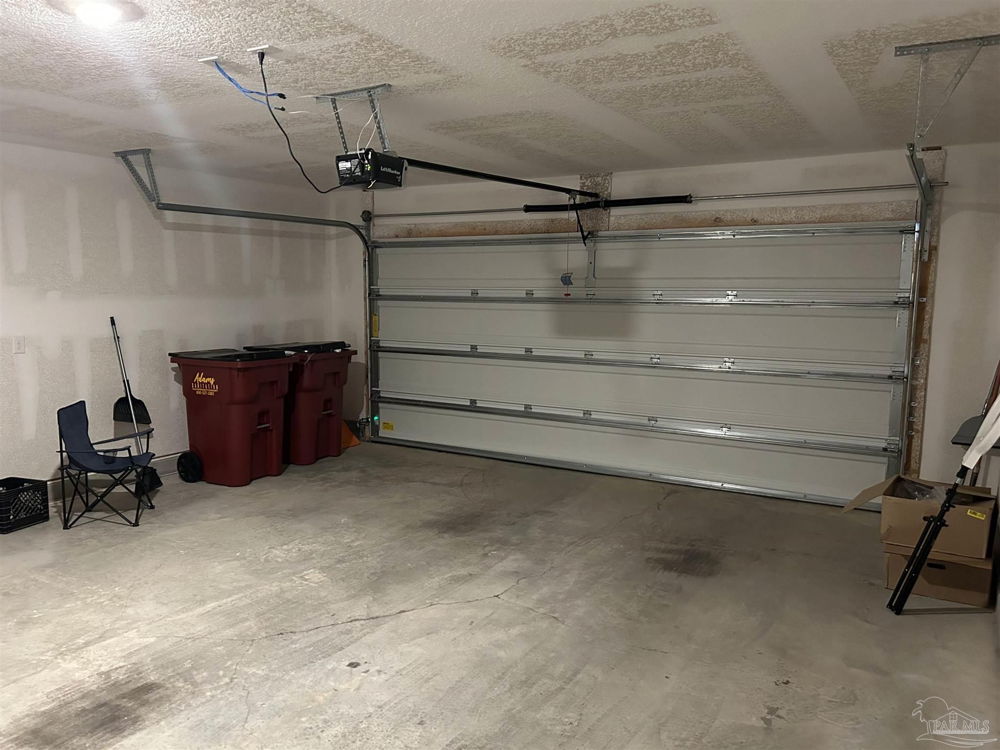 5351 Peach Drive Pace, FL 32571 - Photo 19 of 24 a view of a room with racks on the wall