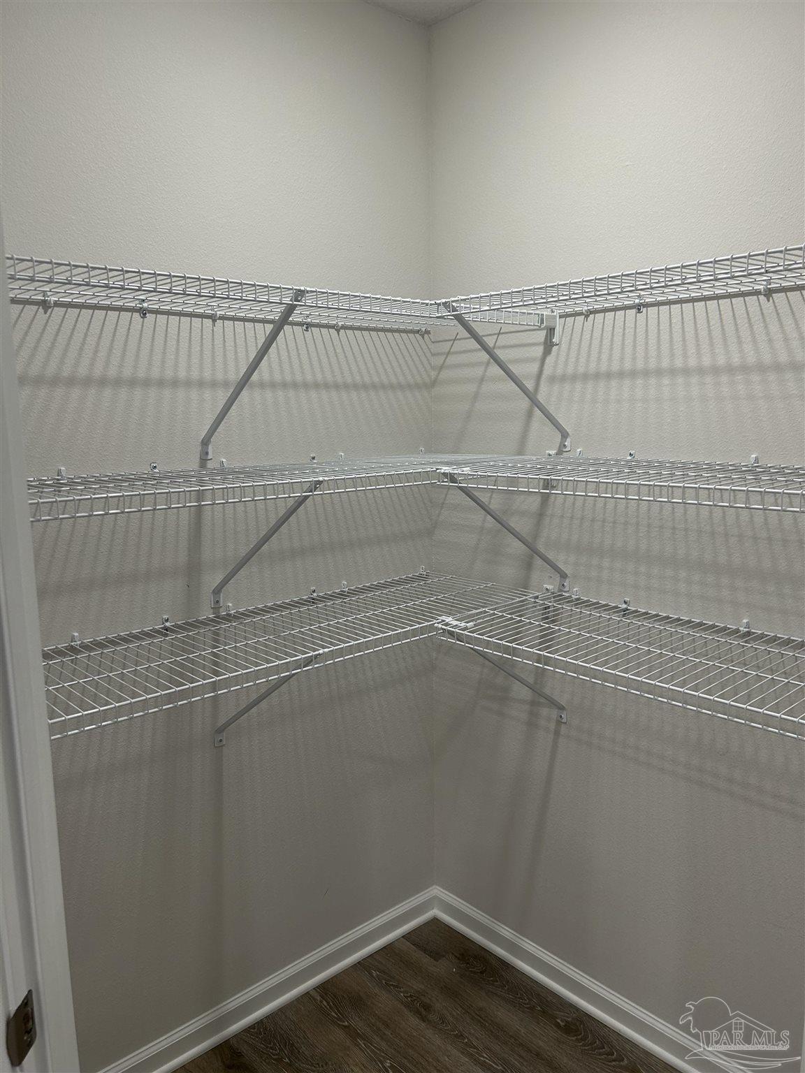 5351 Peach Drive Pace, FL 32571 - Photo 8 of 24 a view of a room with racks on the wall