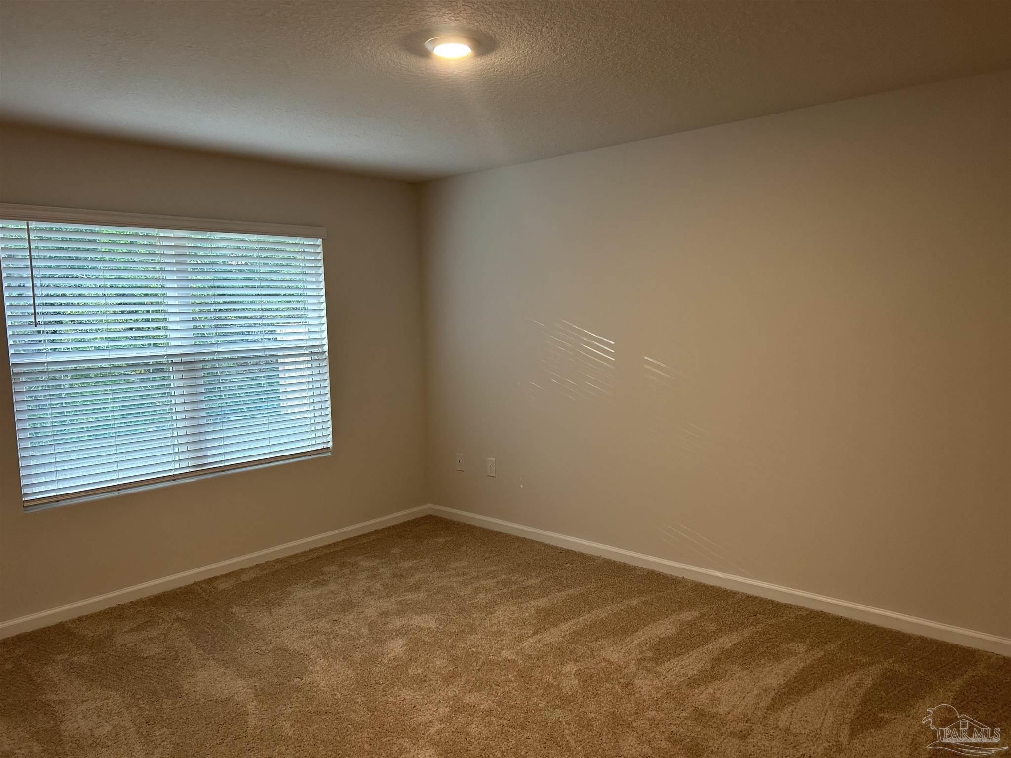 5351 Peach Drive Pace, FL 32571 - Photo 9 of 24 an empty room with a window