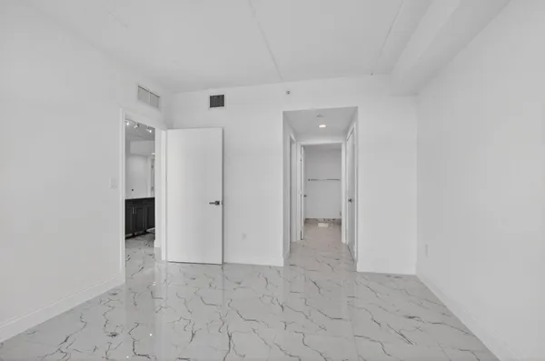 a bathroom with a double vanity sink toilet and shower