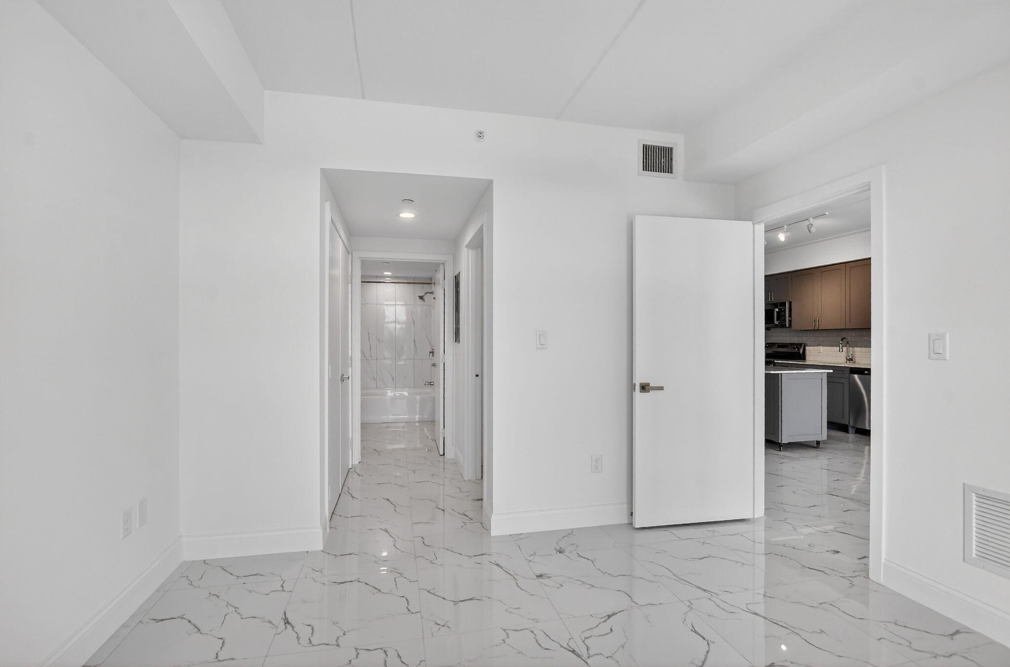 350 West Hidden Valley Boulevard, Unit 201 Boca Raton, FL 33487 - Photo 17 of 33 a view of a hallway with closet and a living room