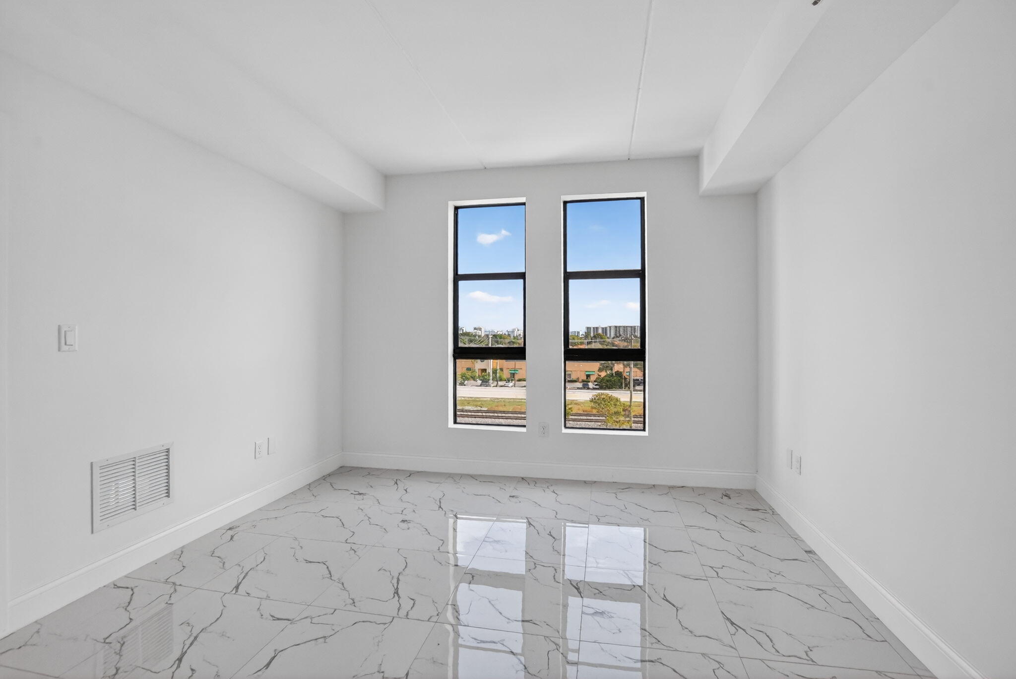 350 West Hidden Valley Boulevard, Unit 201 Boca Raton, FL 33487 - Photo 19 of 33 a view of an empty room with a window