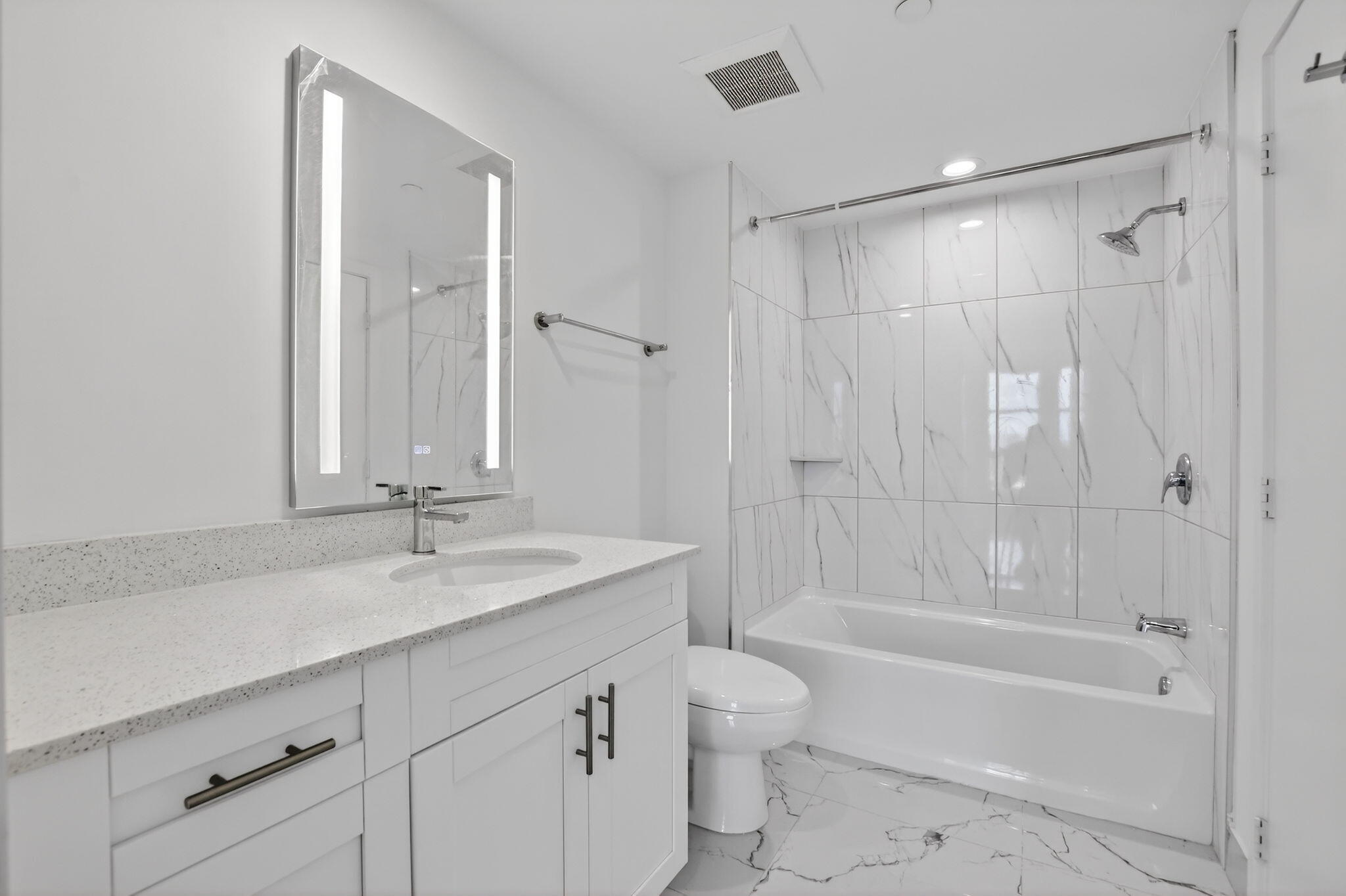 350 West Hidden Valley Boulevard, Unit 201 Boca Raton, FL 33487 - Photo 21 of 33 a bathroom with a sink a toilet and a bathtub
