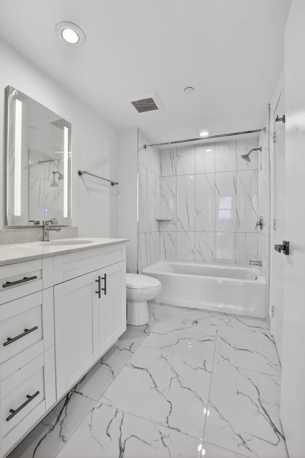 350 West Hidden Valley Boulevard, Unit 201 Boca Raton, FL 33487 - Photo 22 of 33 a bathroom with a granite countertop sink toilet and shower