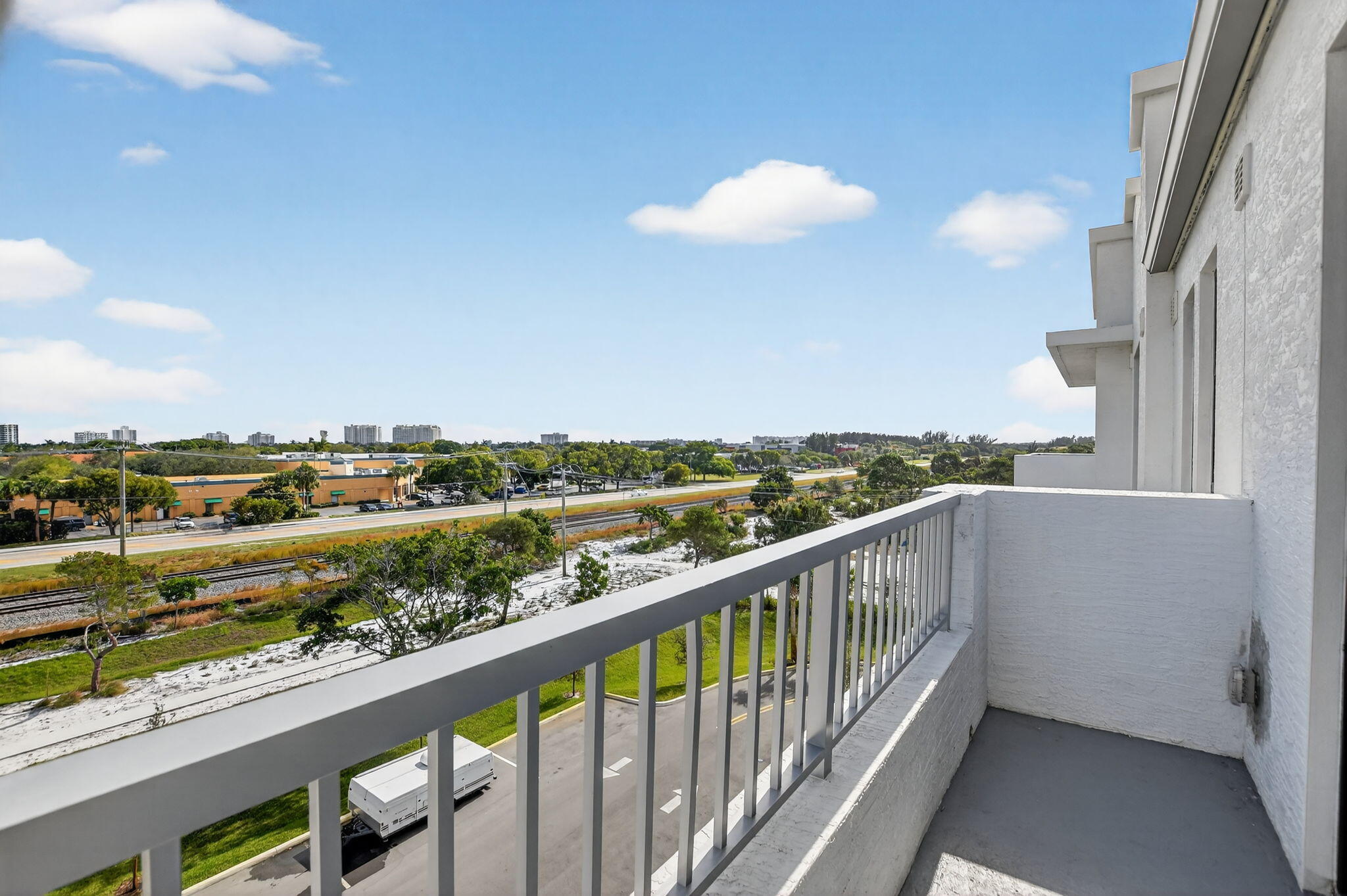 350 West Hidden Valley Boulevard, Unit 201 Boca Raton, FL 33487 - Photo 27 of 33 a view of city and mountain from a balcony