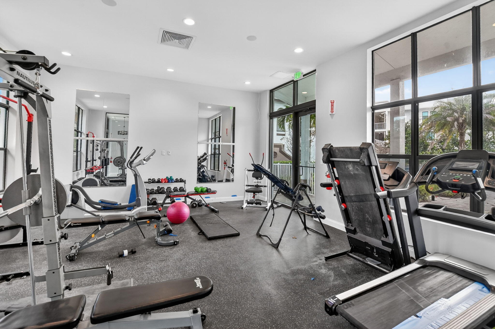 350 West Hidden Valley Boulevard, Unit 201 Boca Raton, FL 33487 - Photo 29 of 33 a view of a room with gym equipment