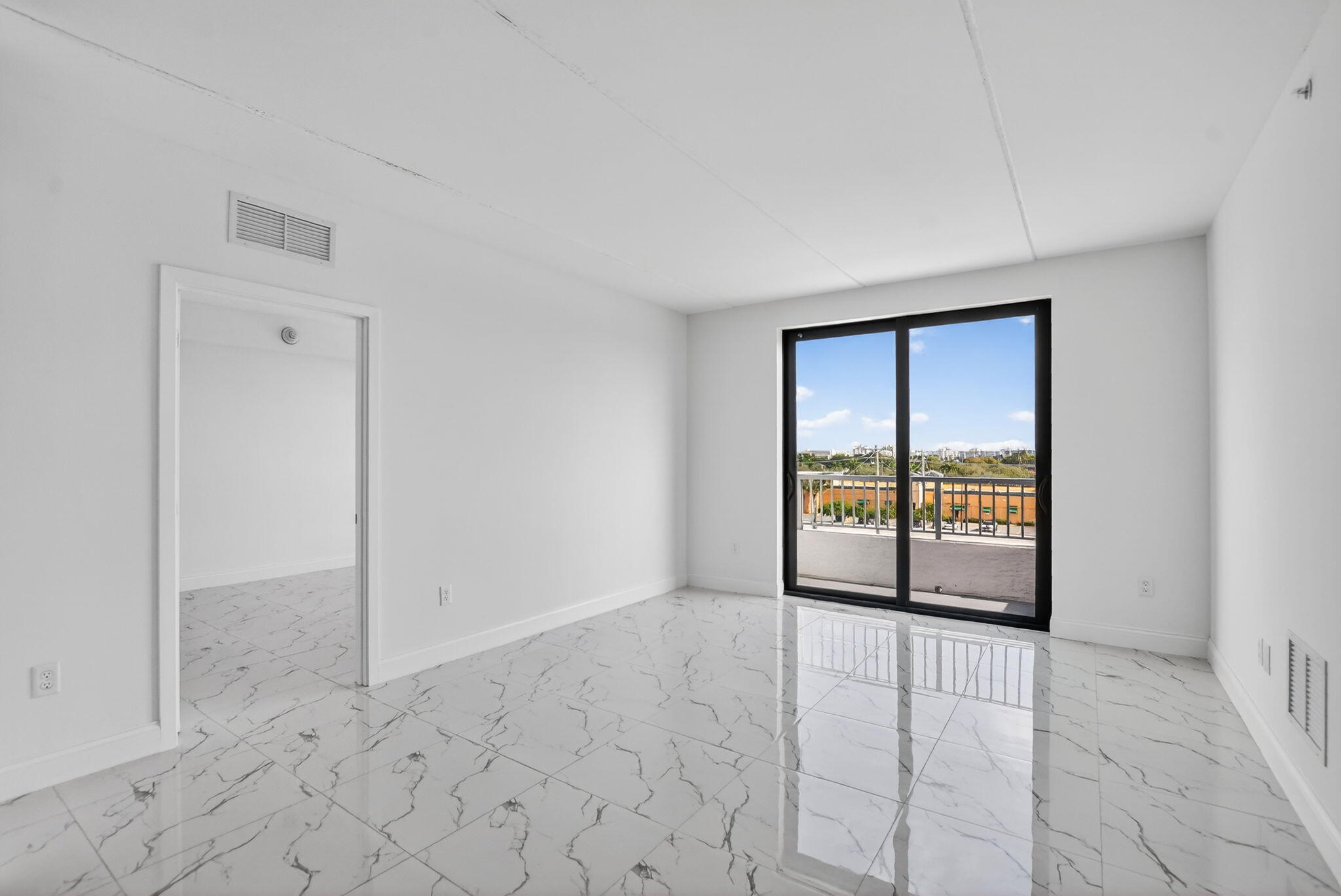 350 West Hidden Valley Boulevard, Unit 201 Boca Raton, FL 33487 - Photo 4 of 33 a view of an empty room with a window