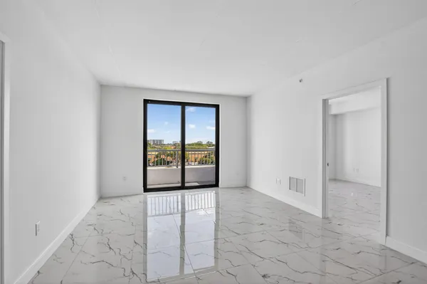 a view of an empty room with a window