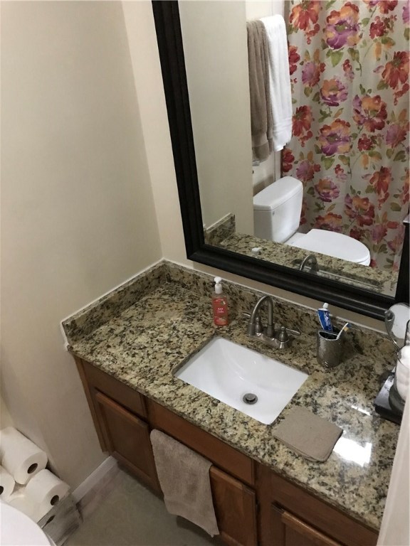 2300 Leon Street, Unit 202 Austin, TX 78705 - Photo 12 of 19 a bathroom with a granite countertop sink and a mirror