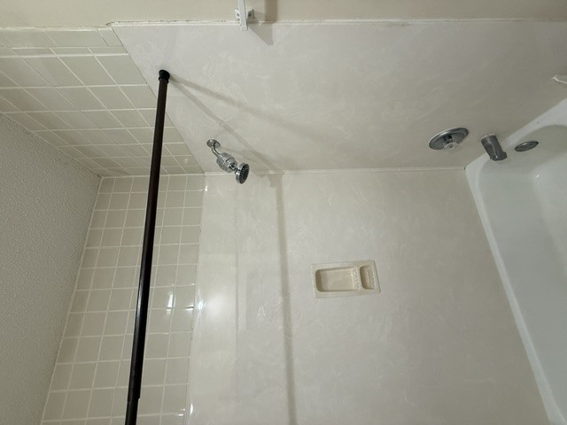 2300 Leon Street, Unit 202 Austin, TX 78705 - Photo 15 of 19 a bathroom with a shower and a bathtub
