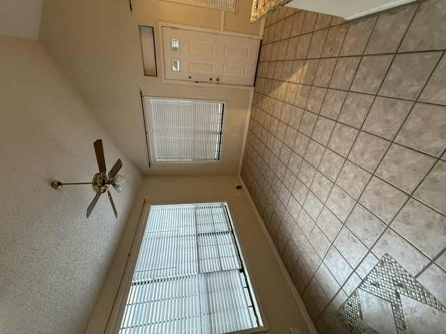 2300 Leon Street, Unit 202 Austin, TX 78705 - Photo 7 of 19 a view of an empty room and window chandelier fan