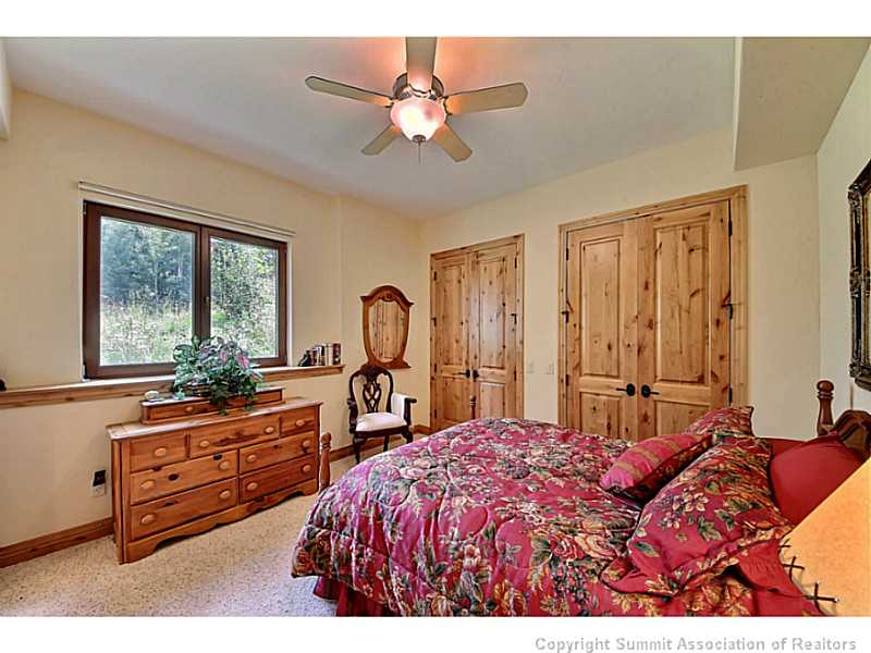 2560 Hunter's Knob Road Silverthorne, CO 80498 - Photo 17 of 25 Bedroom. 1 of 3 lower level bedrooms w/ Cedar lined closet