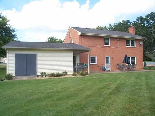 2344 Lyndhurst Road Waynesboro, VA 22980 - Photo 11 of 25 a front view of a house with a garden