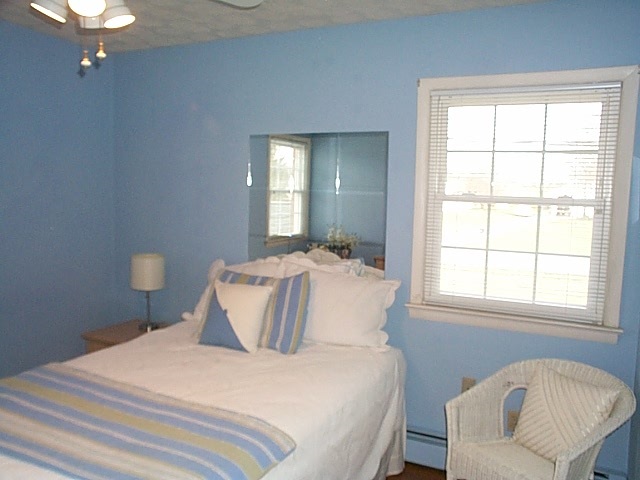 2344 Lyndhurst Road Waynesboro, VA 22980 - Photo 18 of 25 a bedroom with a bed and a chair