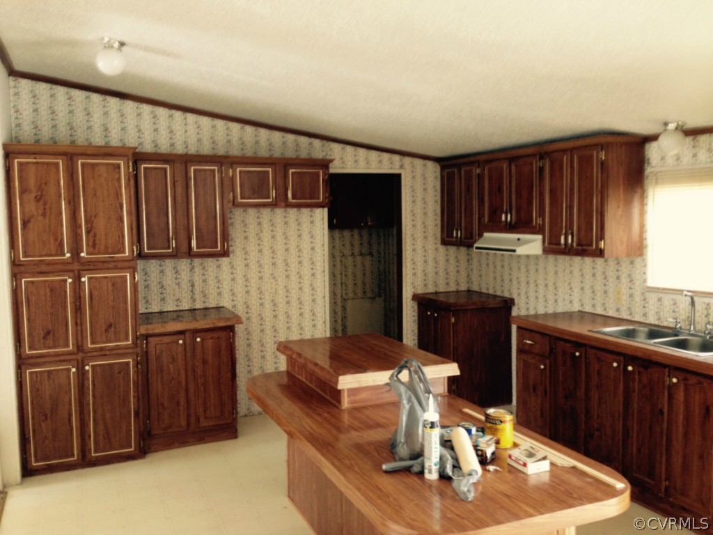 4242 Falls Road Victoria, VA 23974 - Photo 4 of 5 a kitchen with a refrigerator and a sink