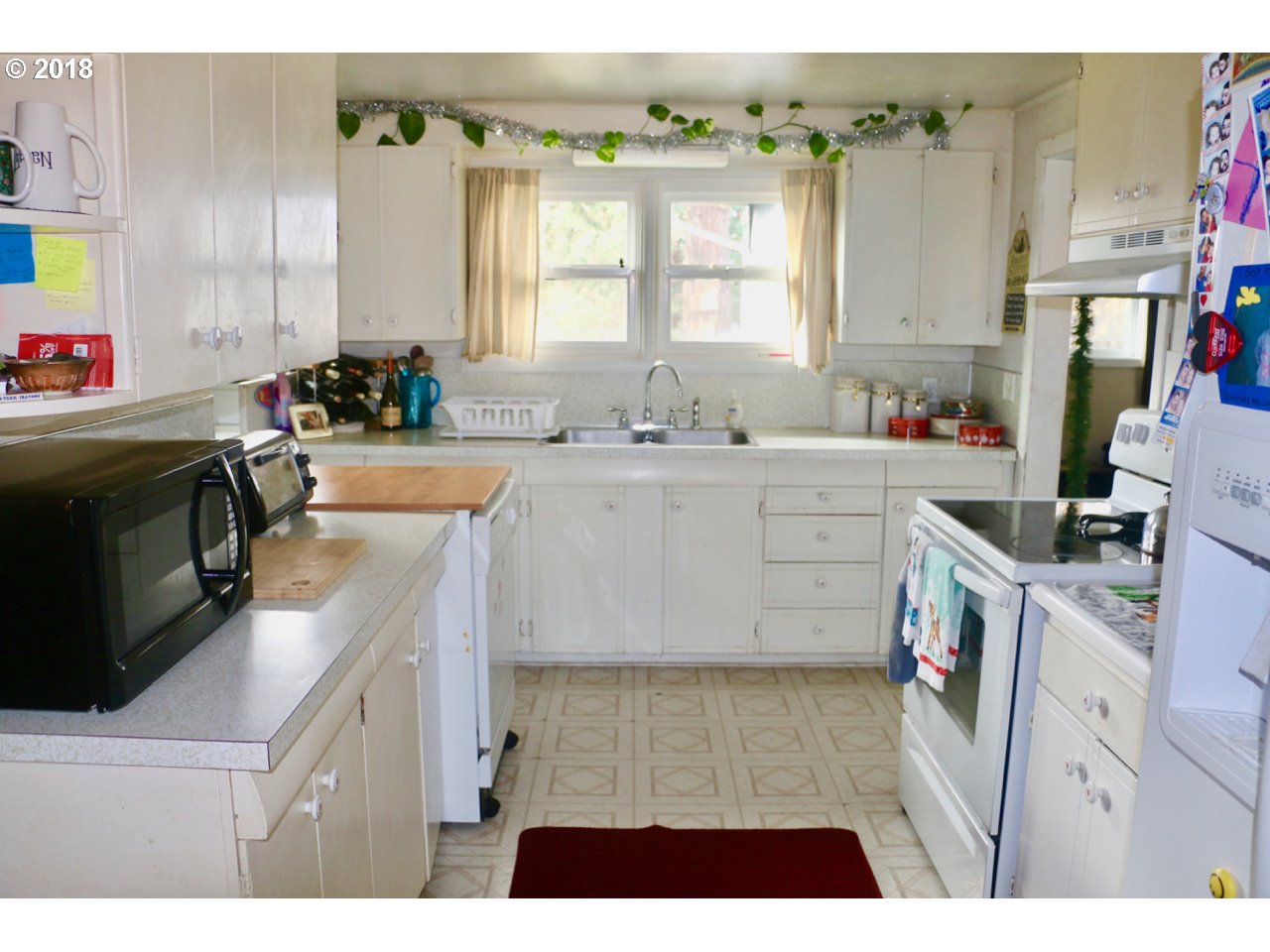 885 25th Place Springfield, OR 97477 - Photo 11 of 15 a kitchen with a sink stove and cabinets