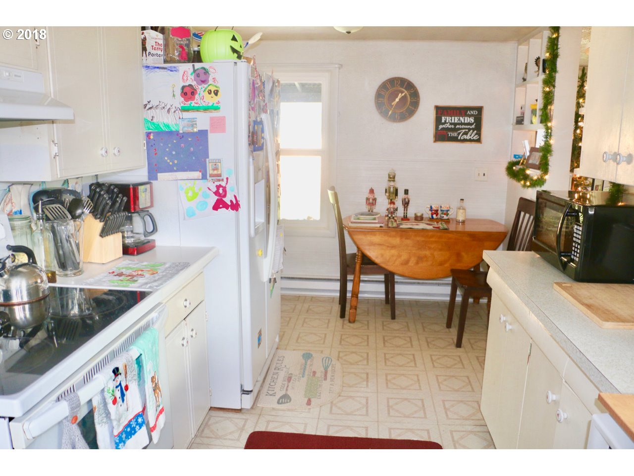 885 25th Place Springfield, OR 97477 - Photo 12 of 15 a kitchen with a dining table and chairs
