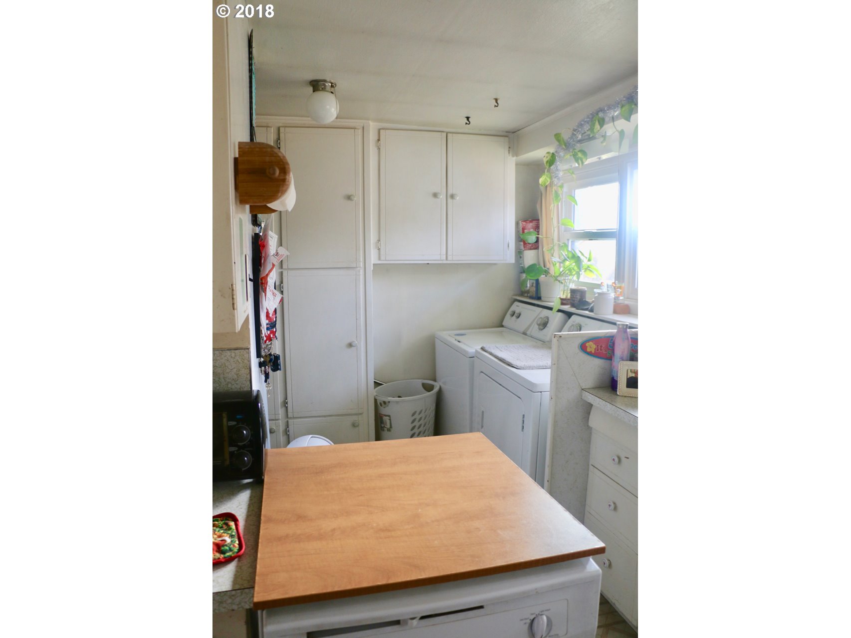 885 25th Place Springfield, OR 97477 - Photo 13 of 15 a room with a sink a washer and dryer
