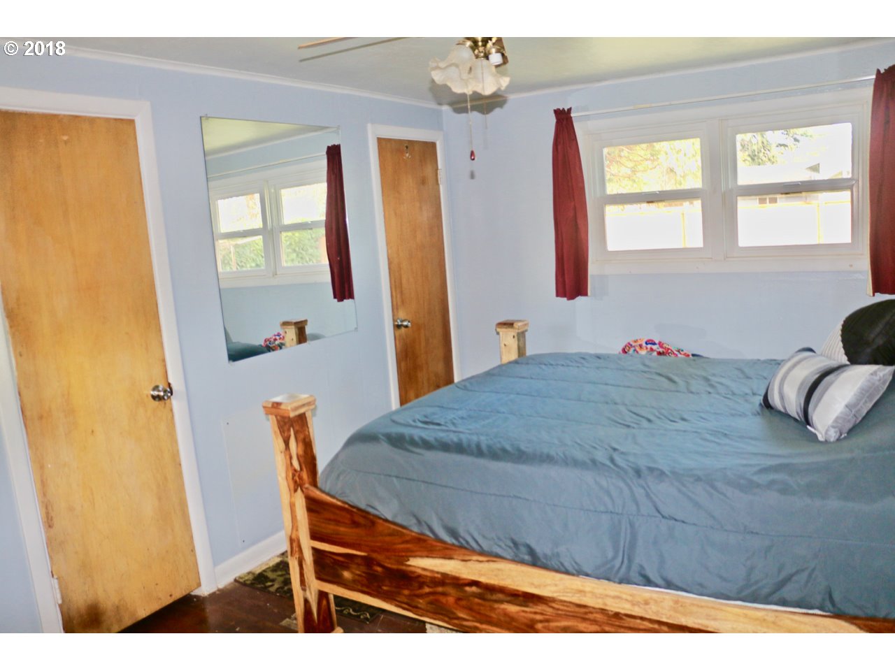 885 25th Place Springfield, OR 97477 - Photo 9 of 15 a bedroom with a bed and a dresser