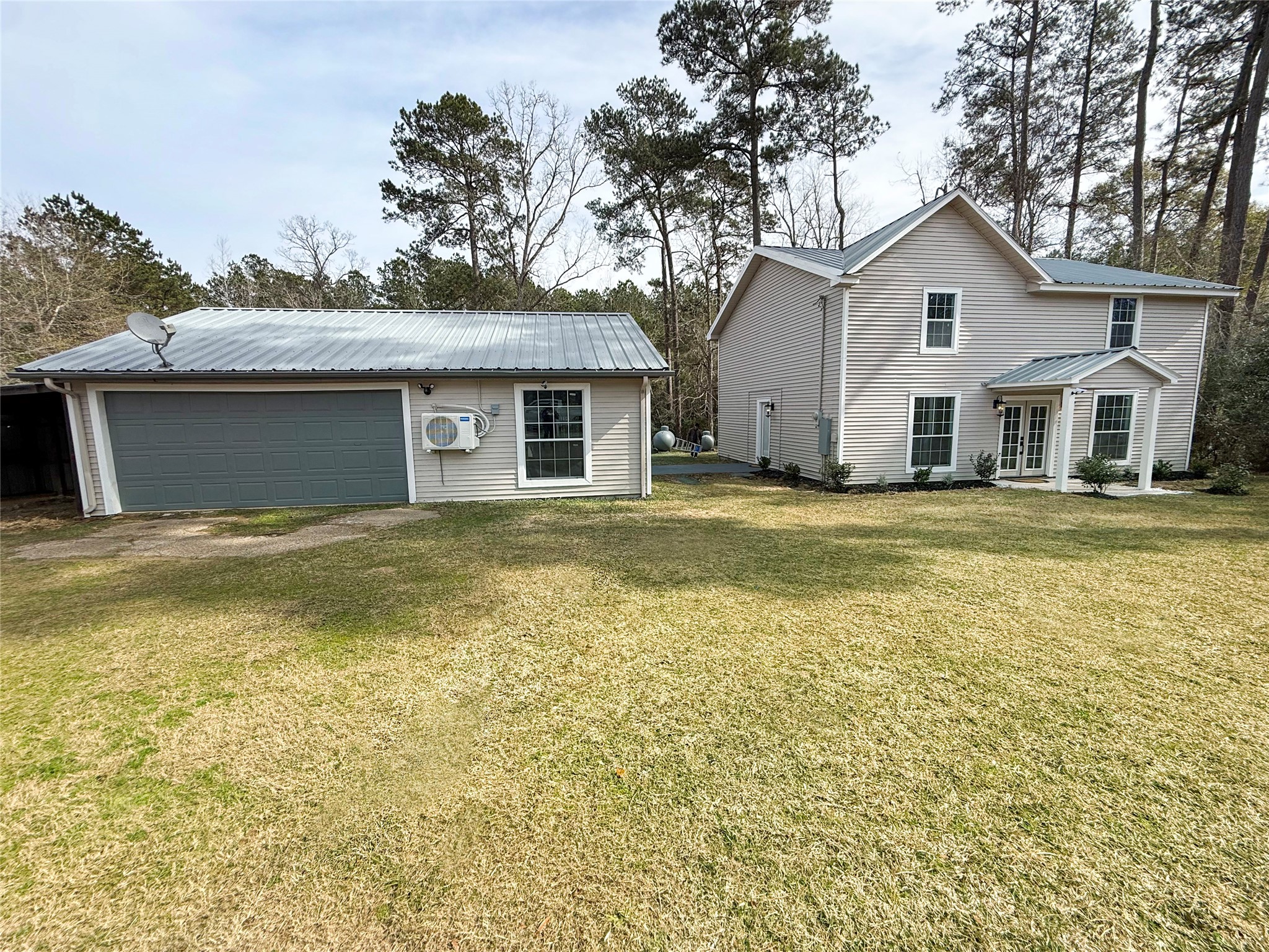 301 County Road 2734 Cleveland, TX 77327 - Photo 4 of 17 a front view of a house with a garden
