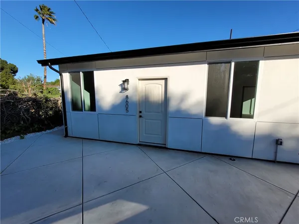 a view of a back yard from a balcony