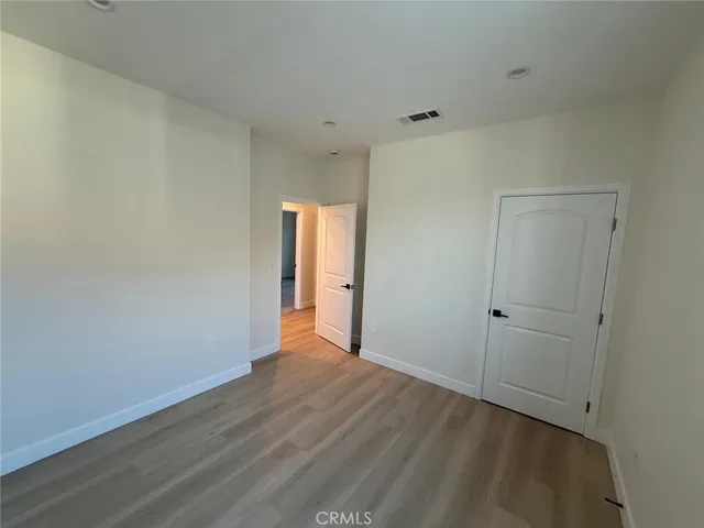 wooden floor and window in an empty room