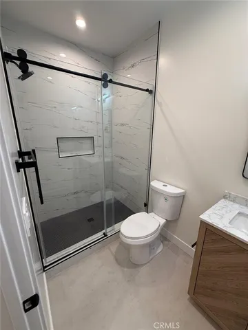 a view of kitchen with wooden floor and electronic appliances