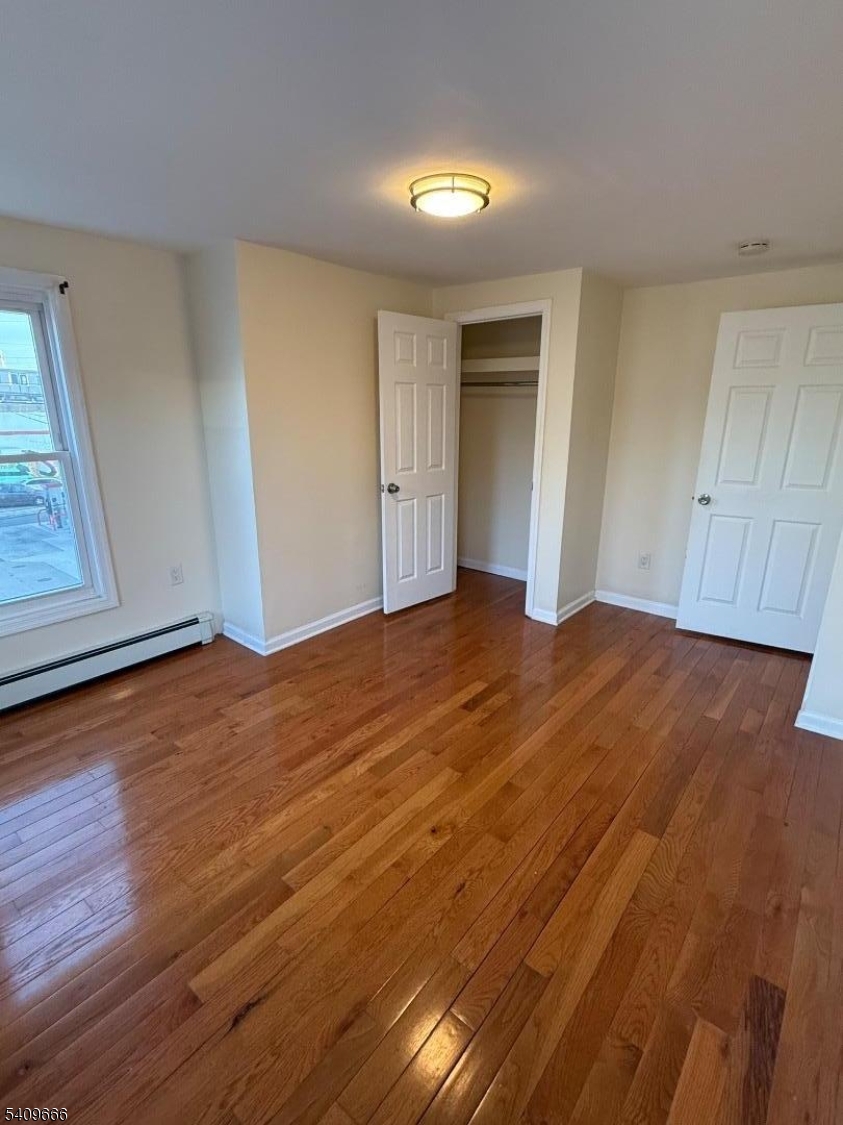30 Elm Street, Unit 2 Newark, NJ 07102 - Photo 5 of 10 a view of an empty room with closet and a window