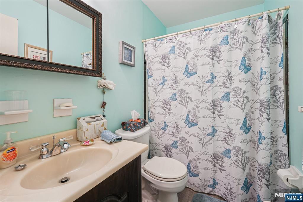 181 Long Hill Road, Unit K5 Little Falls, NJ 07424 - Photo 21 of 48 a bathroom with a sink and a toilet