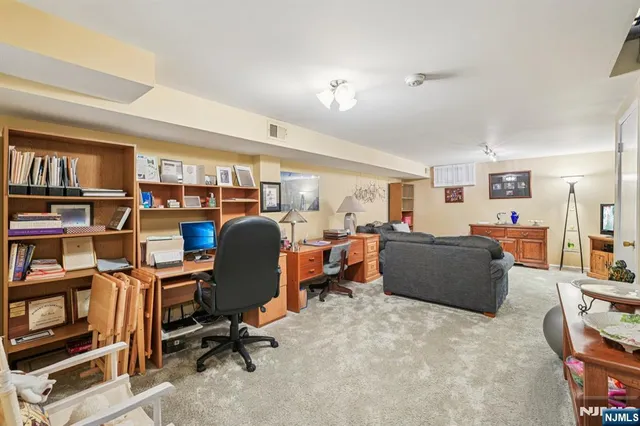 a front view of a residential apartment building with a yard