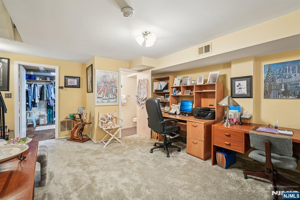 181 Long Hill Road, Unit K5 Little Falls, NJ 07424 - Photo 24 of 48 a view of a workspace with furniture and a workspace