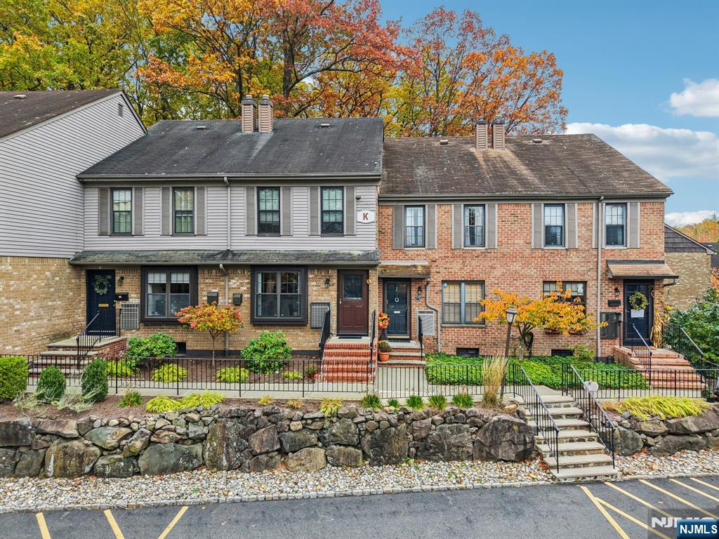 181 Long Hill Road, Unit K5 Little Falls, NJ 07424 - Photo 36 of 48 a front view of a house with garden