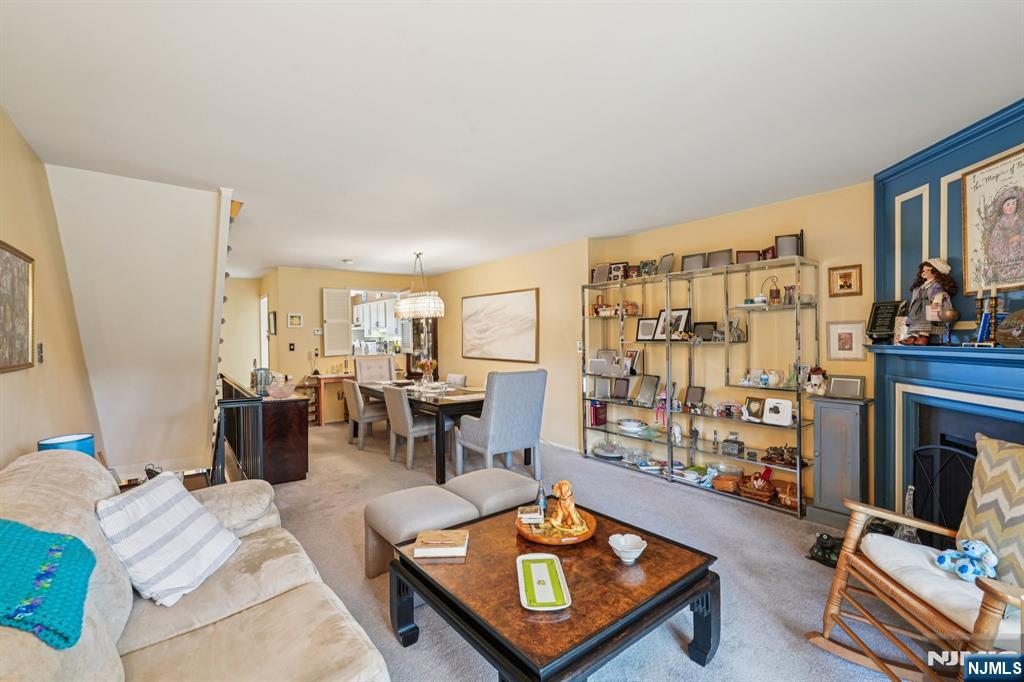 181 Long Hill Road, Unit K5 Little Falls, NJ 07424 - Photo 4 of 48 a living room with furniture and a flat screen tv