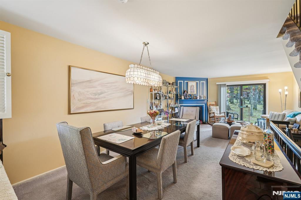 181 Long Hill Road, Unit K5 Little Falls, NJ 07424 - Photo 6 of 48 a view of a dining room with furniture window and outside view