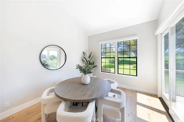 a view of a house with a table and chairs
