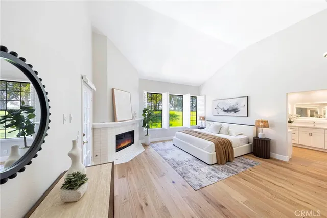 a bedroom with furniture fireplace and window