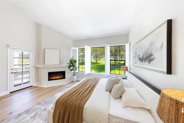 a bedroom with a bed and a fireplace