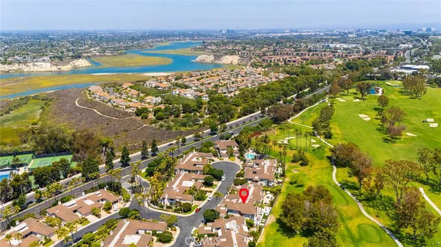 an aerial view of residential houses with outdoor space