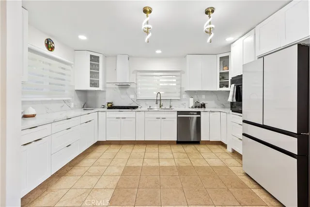 a kitchen with a white cabinets and white appliances