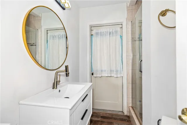 a bathroom with a sink and a mirror