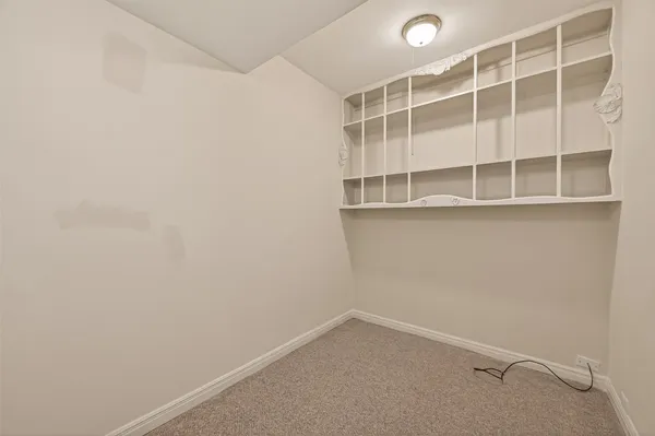a bathroom with a sink and mirror with toilet