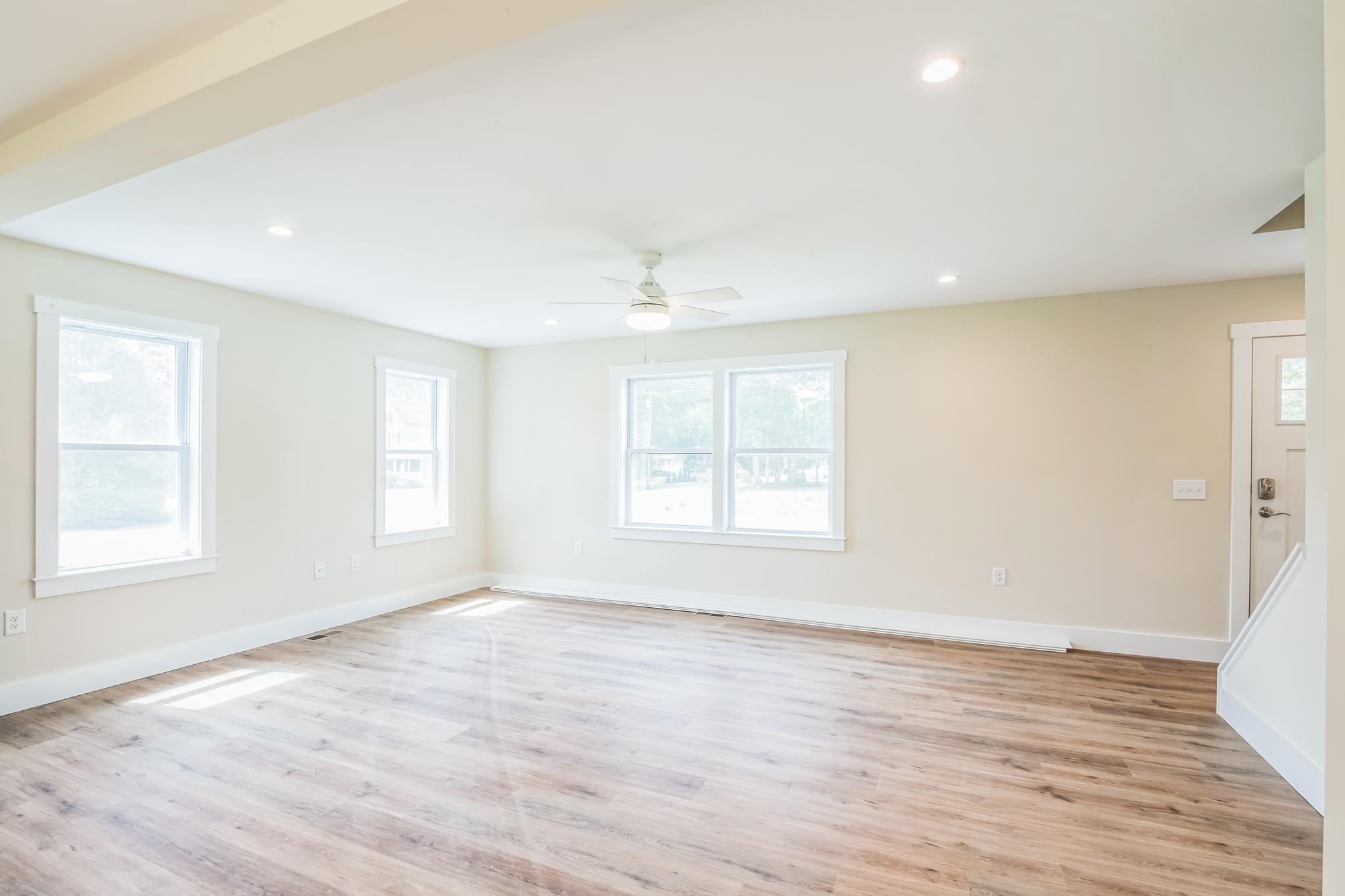 70 West Rising Sun Drive Ocean View, NJ 08230 - Photo 8 of 34 an empty room with wooden floor and windows