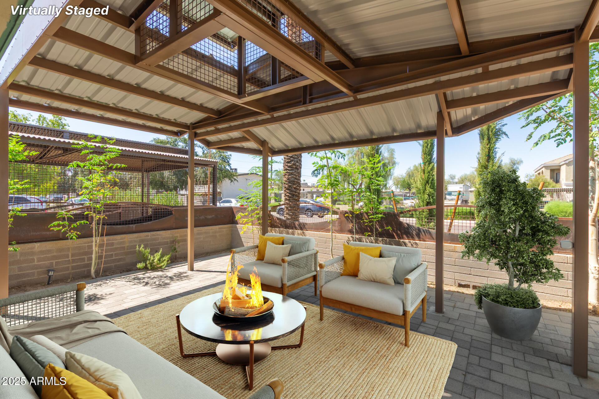 a living room with patio furniture and a potted plant
