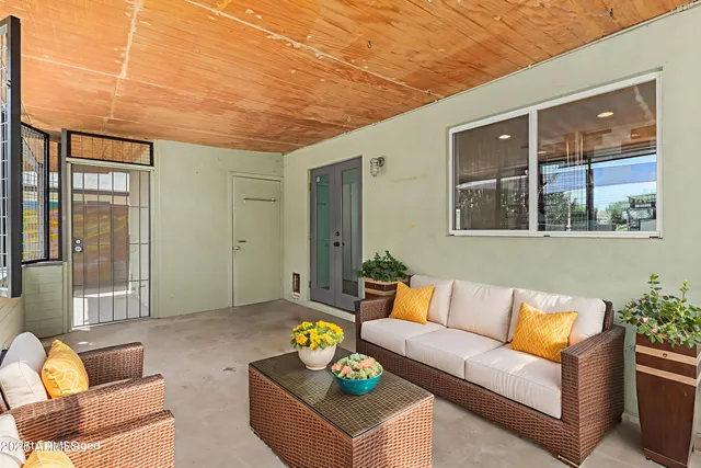 a outdoor living space with furniture and a potted plant