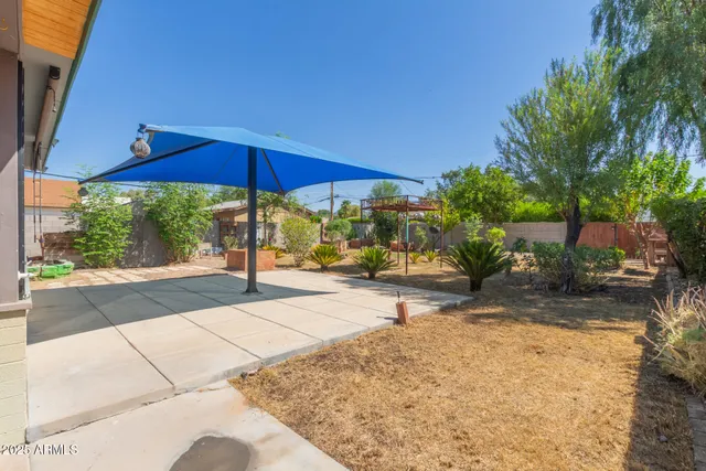 a view of a backyard with sitting area