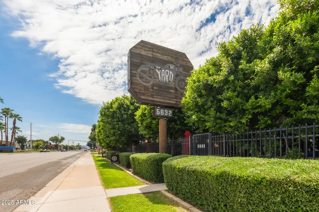 a front view of a building with garden