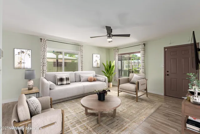 a living room with furniture and a large window