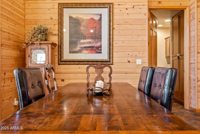 a view of a dining room with furniture and window