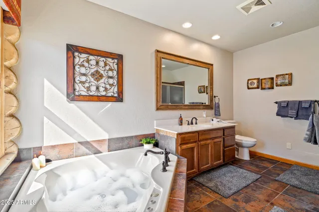a bathroom with a sink a mirror and a shower