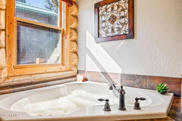 a bathroom with a shower and a tub